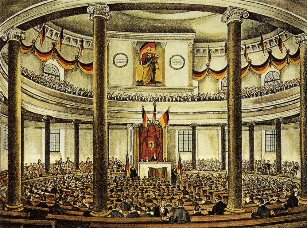 Zeitgenössige_Lithografie_der_Nationalversammlung_in_der_Paulskirche Zeitgenössige_Lithografie_der_Nationalversammlung_in_der_Paulskirche